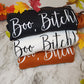 Black sweatshirt with white boo bitch, white sweatshirt with black boo bitch and burnt orange sweatshirt with white boo bitch.