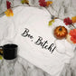 White sweatshirt/crewneck with black boo bitch lettering.